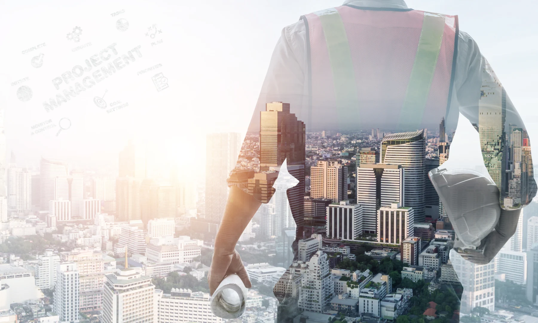 Construction manager overlooking city skyline, representing project management services in high-end hospitality development.